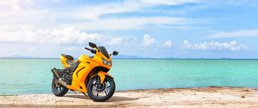 Panoramic scene of sport motorcycle at the beach