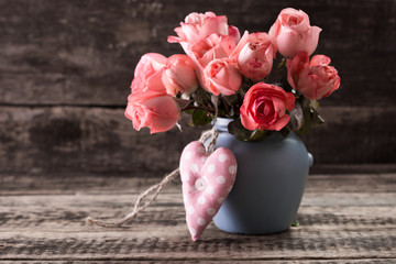Romantic floral frame background Valentines day background Pink roses on wooden background