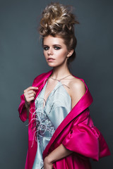 Beautiful girl in evening dress with avant-garde hairstyles. Beauty the face. Photos shot in the...