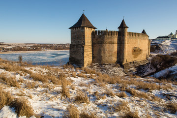Fototapeta na wymiar Ancient stone castle in winter. Landscape.