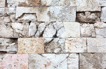 Ancient stone wall close-up.