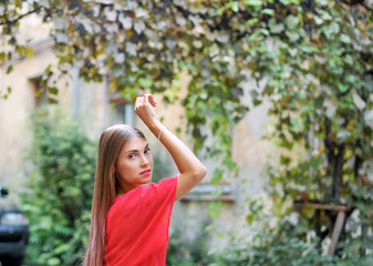 Fototapeta premium Portrait of beautiful female model in the garden 