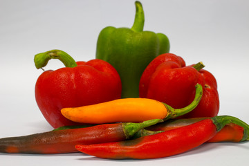 Red ,Green and Yellow peppers isolated on white background