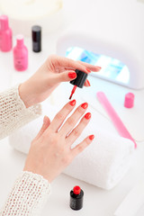 Manicure and hybrid nails painting process.