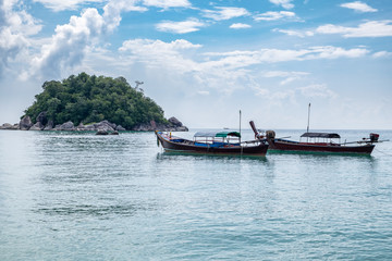 Fototapeta na wymiar Longtail boats anchored on the sea