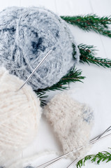 warm woolen thread and knitting spokes