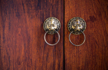 Close-up China style door handle on natural wooden door , select