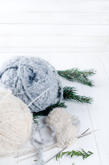 warm woolen thread and knitting spokes