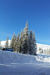 Winter in carpatian mountains. Road through
deep snow.