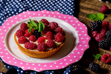 tart with cream and raspberries