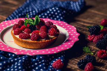 tart with cream and raspberries