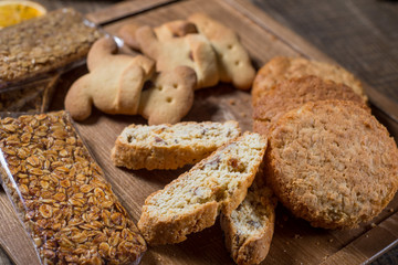Different cookies on a wooden board