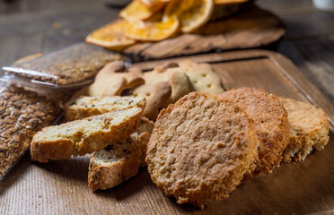 Different cookies on a wooden board