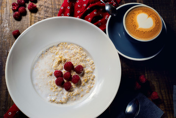 dish of oatmeal and a cup of coffee