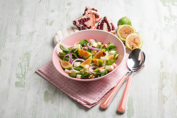 mixed salad with valerian figs cheese and pomegranate