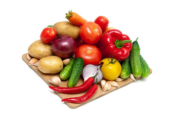 vegetables on a cutting board on white background