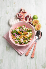 mixed salad with valerian figs cheese and pomegranate