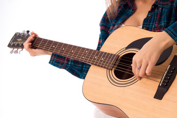 woman playing guitar in studio