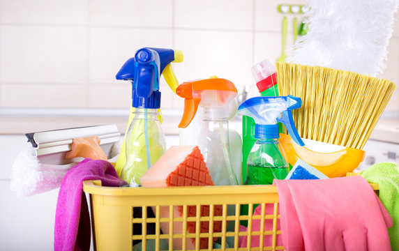 Cleaning supplies in basket in kitchen
