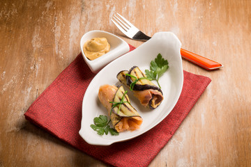 salmon rolled up with eggplant and mustard