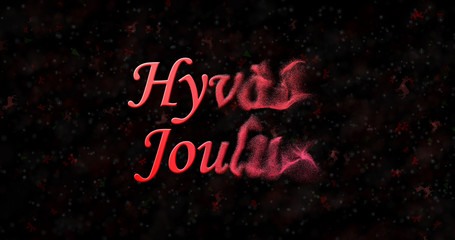 Merry Christmas text in Finnish "Hyvaa joulua" turns to dust from right on black background