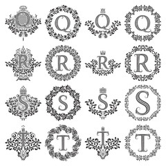 Vintage monograms set of letters Q, R, S, T. Heraldic coats of arms, symbols in floral round and square frames.