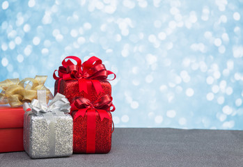 Christmas gift box and decoration on light bokeh background