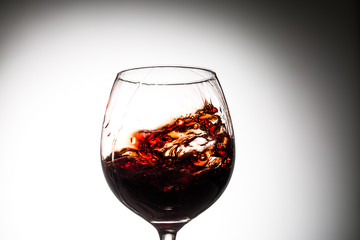 Stream of wine being pouring into a glass.