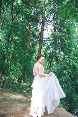 Beautiful Bride portrait wedding makeup and hairstyle . Bride in the park