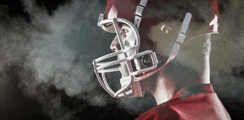 Composite image of american football player looking at camera © vectorfusionart