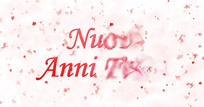 Happy New Year text in Italian "Nuovi anni felici" turns to dust from bottom on white background
