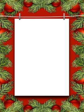 Blank frame hanged by pegs against red background enclosed by red Christmas ornaments and leaves