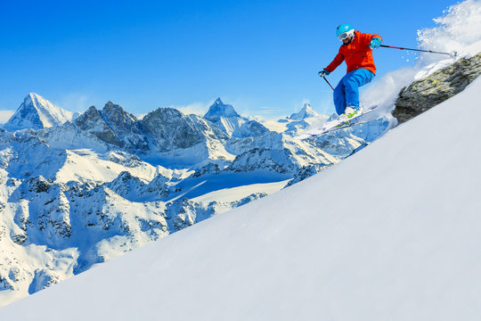 Skiing with amazing view of swiss famous mountains in beautiful