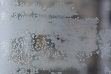 beautiful winter frosty snow fairy pattern on glass, texture, background