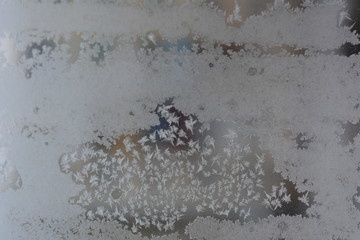 beautiful winter frosty snow fairy pattern on glass, texture, background