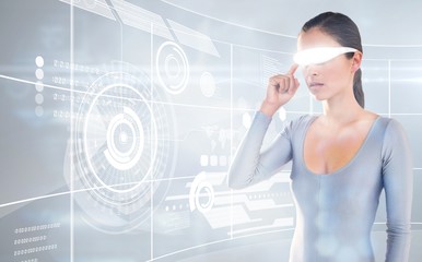 Composite image of young woman using virtual video glasses