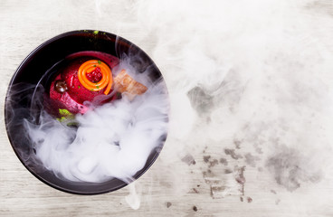 Molecular Cuisine. Delicious soup with beetroot.