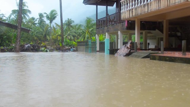 Street under flood in Koh Phangan, Thailand. December 2016