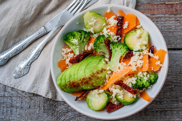 Couscous with broccoli, avocados, carrots, Brussels sprouts, dried tomatoes and pine nuts. . Perfect for the detox diet or just a healthy meal.  Love for a healthy raw food concept.