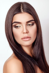 Fototapeta premium young brown-haired sexy girl over gray background, beautiful hea