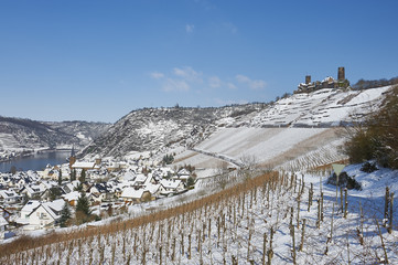GERMANY, MOSELLE, Castle Thurant above village Alken Mosel valley during winter covered with snow. It was first mentioned in the 13. century