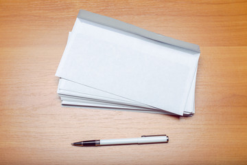 Photo of blank envelope on a  wooden background