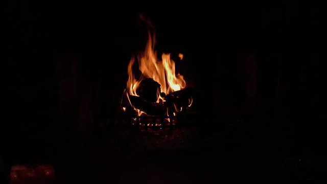 Fire Logs Burning In A Fireplace