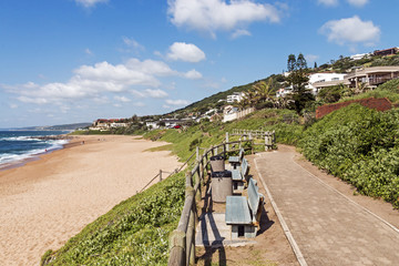 Paved Walkway Green Dune Vegetation Sand  and Residential Housin