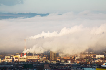 Industrial landscape with factory chimneys.