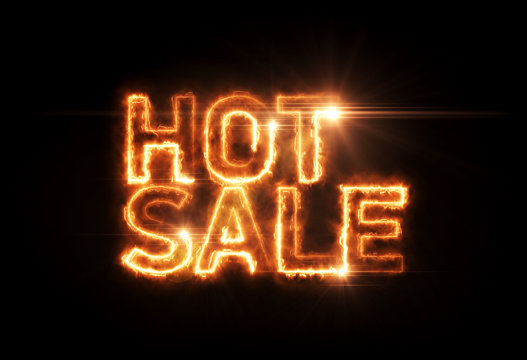 Burning inscription "hot sale" on a black background