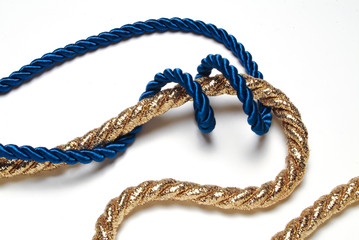 blue and golden rope on white
