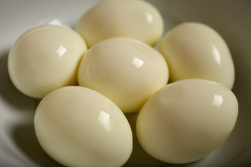 Six peeled, hard boiled eggs