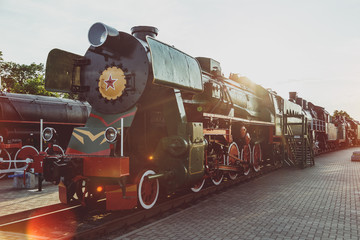 The old Soviet locomotive at sunset