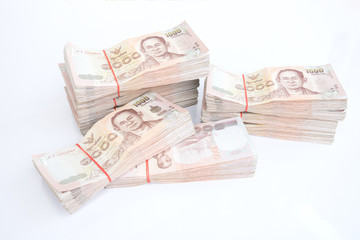 stack of 1000 bath Thai money : New Thailand Currency 1000 Bath with the image of Thai King Bhumibol Adulyadej. BankNotes isolated on white background WITH copy space.

